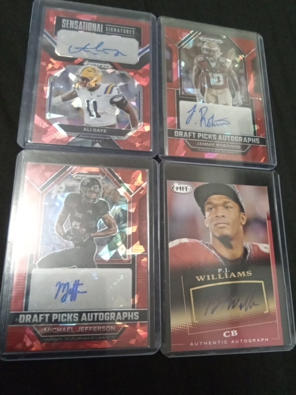 Autographed Football Trading Card Lot - Red / Black Accents 4 Players.
